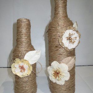 2 Jute wrapped wine bottles/vases. Burlap flowers.